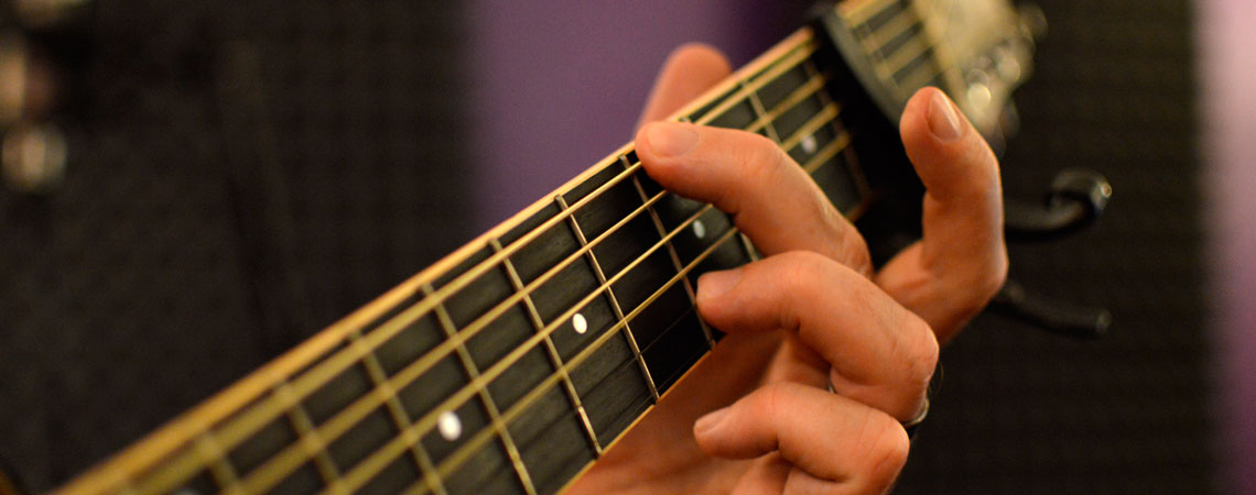 playing acoustic guitar